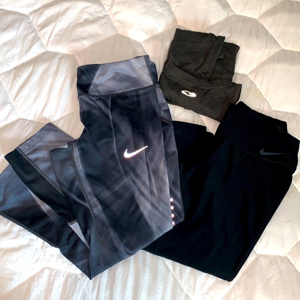 Two Nike leggings and a champion tank top